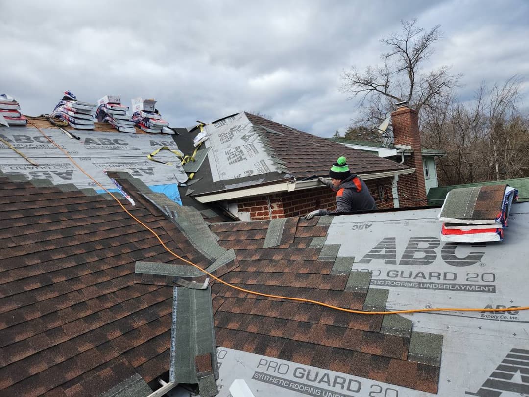 Roofers putting on a new shingle roof