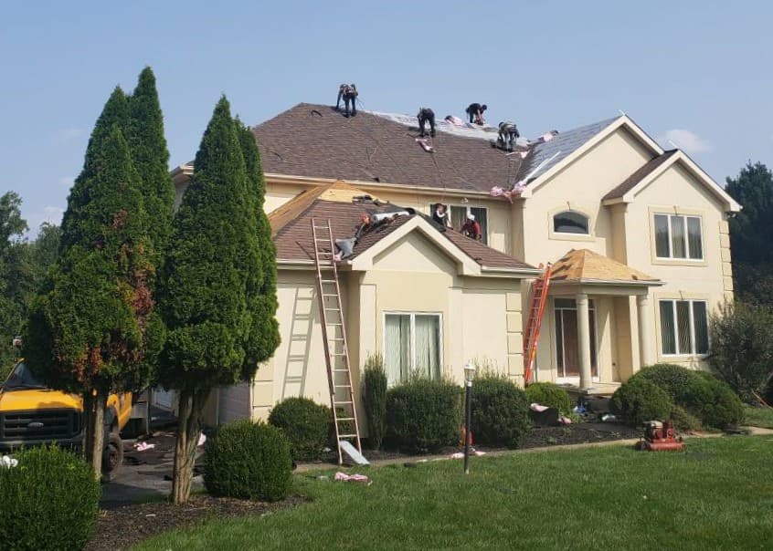 Roofers working on a roof